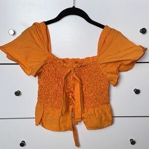 Anthropologie Orange Smocked Blouse